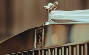 High quality close up of a chrome silver rolls Royce bonnet