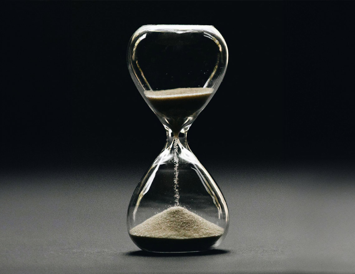 Transparent hourglass with sand falling