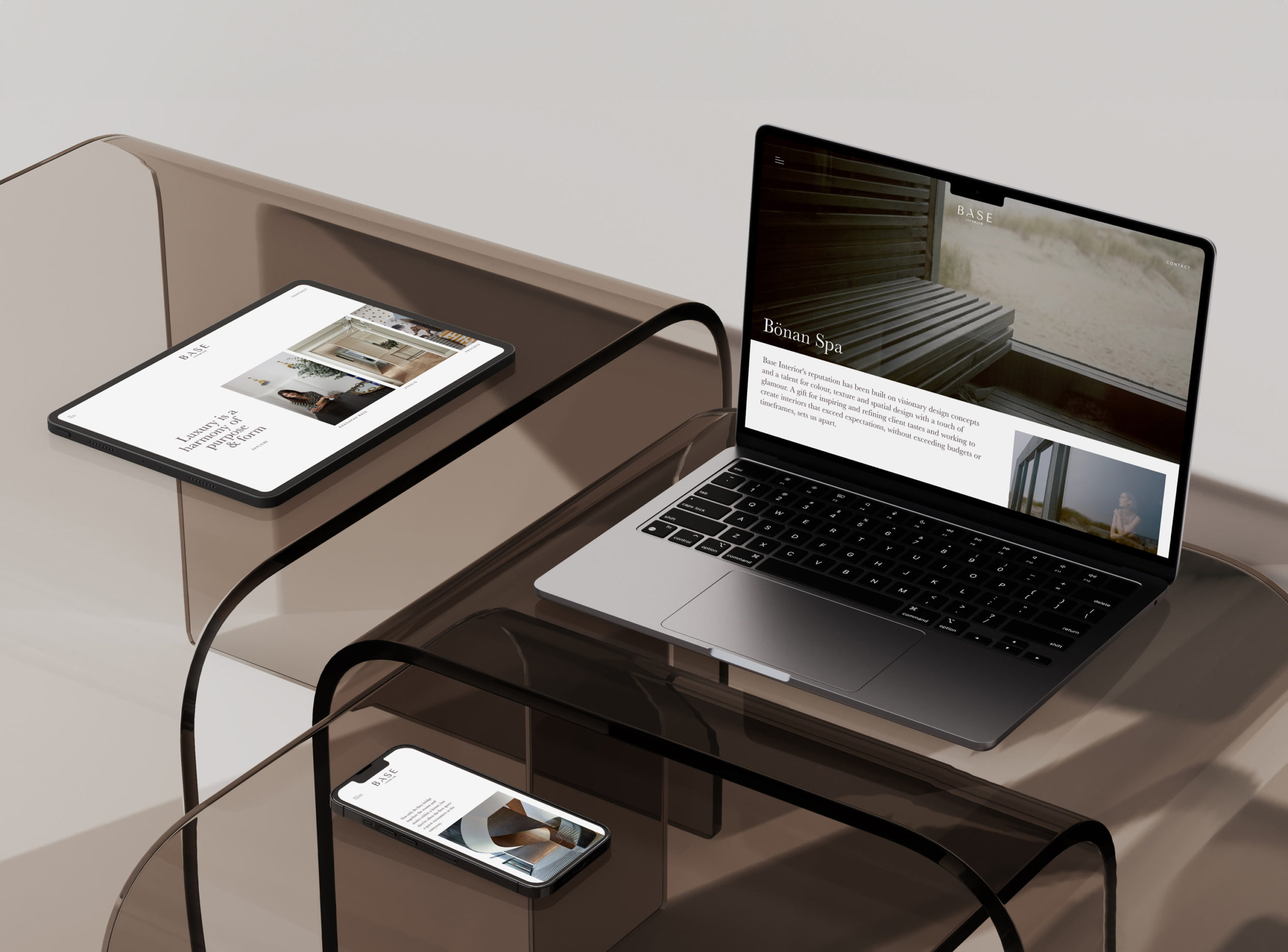 Base Interior client - desktop, tablet and mobile designs mocked up on devices