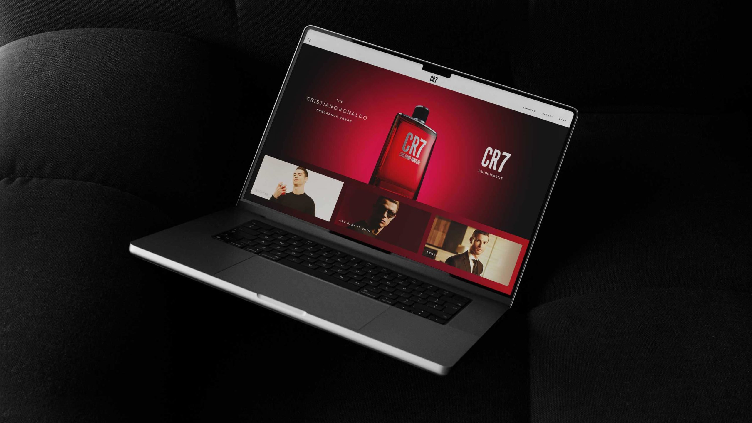 Silver laptop displaying homepage of Cristiano Ronaldo's CR7 fragrance